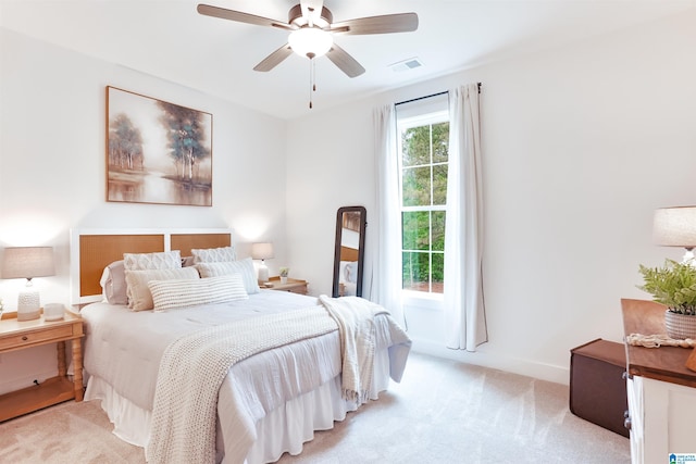 carpeted bedroom with ceiling fan