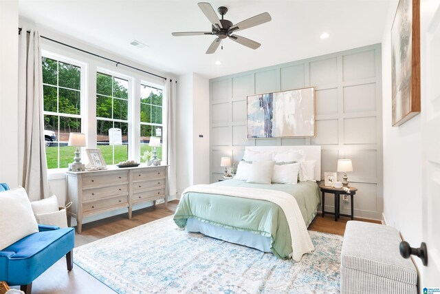 bedroom with wood-type flooring and ceiling fan