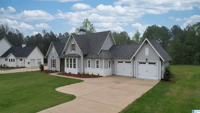 view of front of property featuring a garage and a front lawn