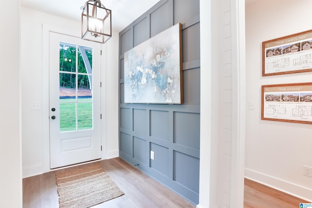 doorway to outside with light hardwood / wood-style flooring