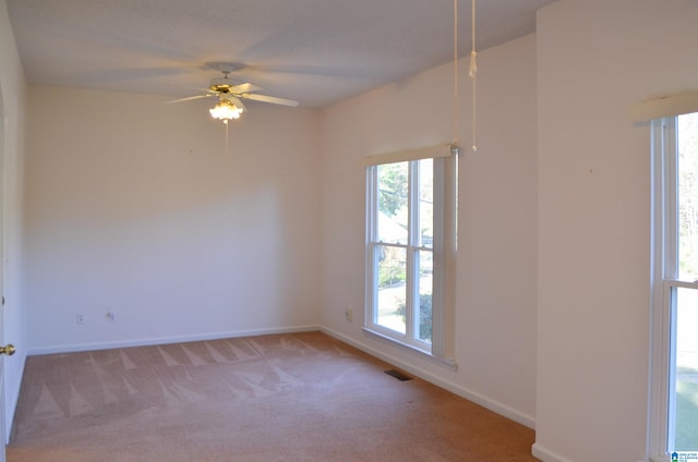 carpeted empty room with ceiling fan