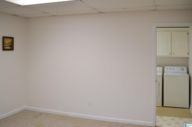 washroom with cabinets, separate washer and dryer, and light colored carpet