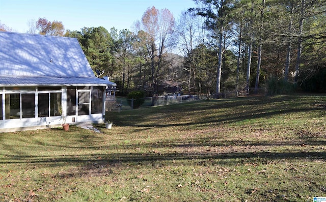 view of yard with a sunroom