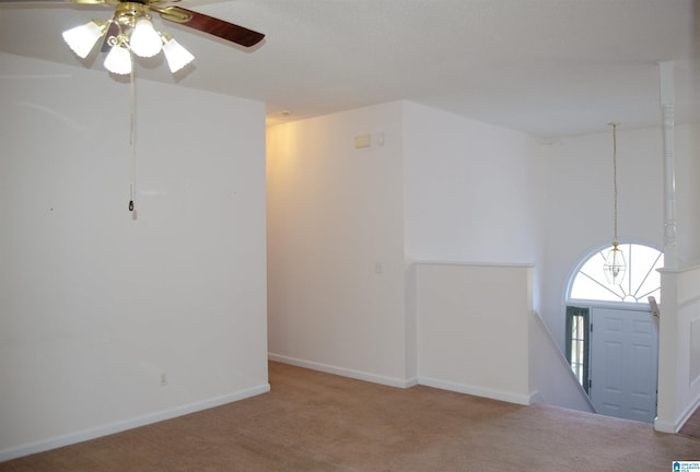 spare room with carpet floors and ceiling fan