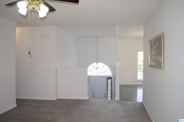 interior space featuring dark carpet