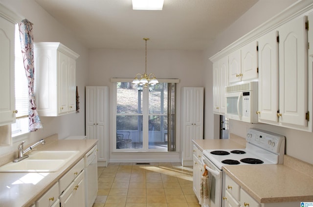 kitchen featuring sink, light tile patterned floors, pendant lighting, white appliances, and white cabinets