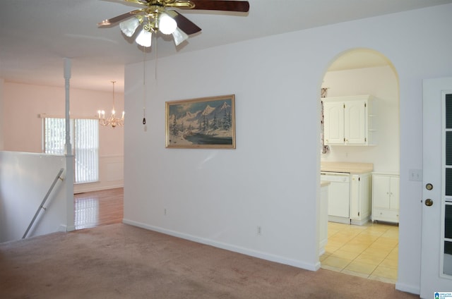 interior space with light carpet and a chandelier