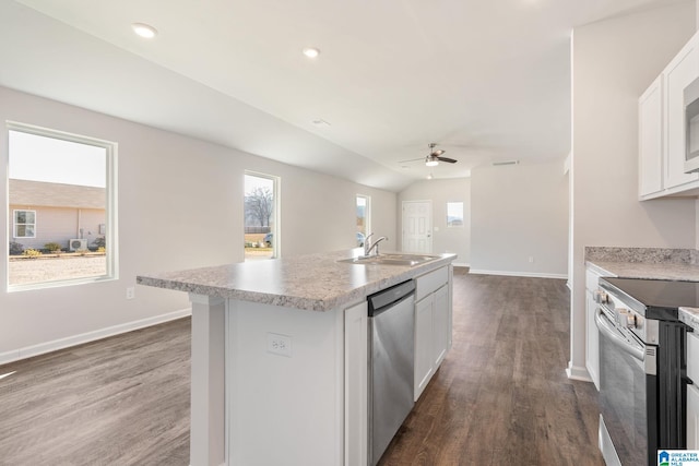 kitchen featuring sink, an island with sink, a wealth of natural light, appliances with stainless steel finishes, and white cabinetry