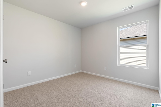 unfurnished room with carpet flooring