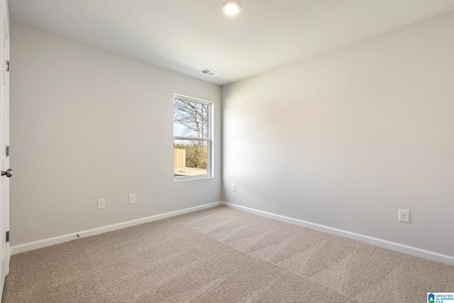 unfurnished room featuring carpet flooring