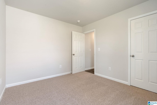 unfurnished bedroom featuring carpet flooring