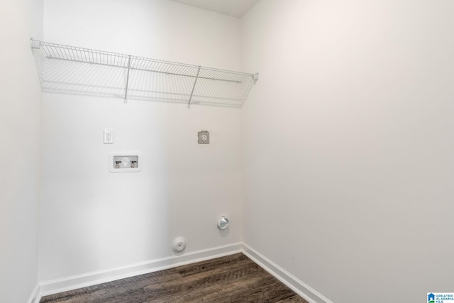 clothes washing area with washer hookup, dark hardwood / wood-style floors, hookup for an electric dryer, and gas dryer hookup