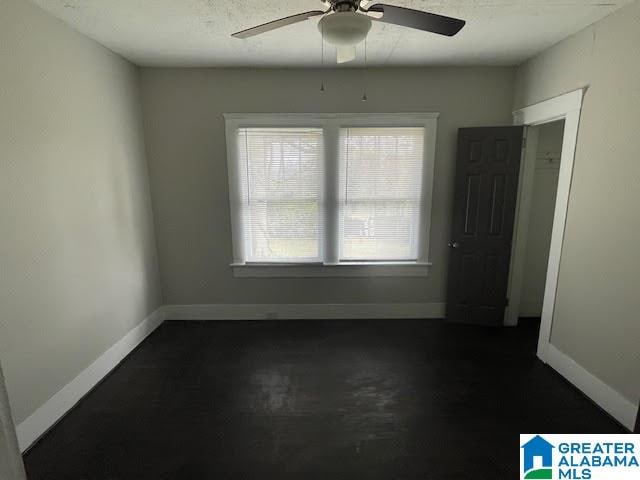 spare room featuring ceiling fan