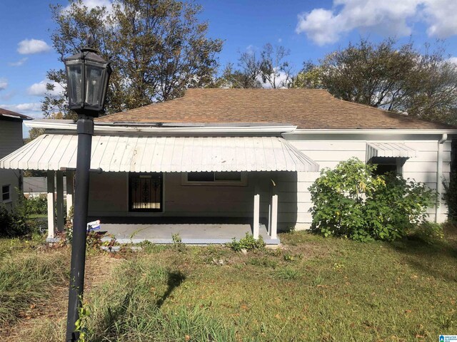 2724 20th Pl, Ensley, Birmingham, AL 35208 - view of home's exterior with a yard and roof with shingles