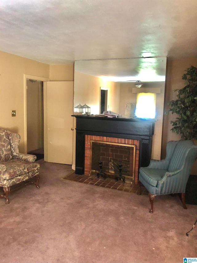 sitting room with carpet floors and a brick fireplace