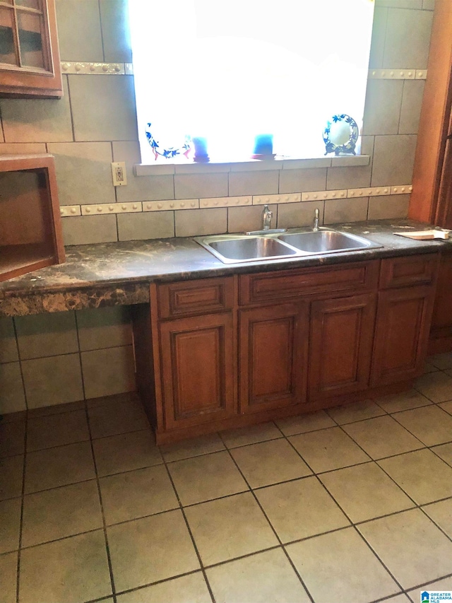 kitchen featuring decorative backsplash and sink