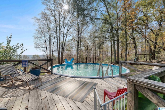 view of pool featuring a wooden deck