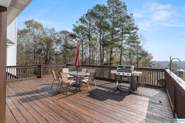 wooden terrace featuring area for grilling