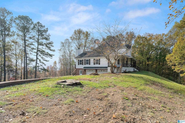 view of front of home featuring a garage and a front lawn