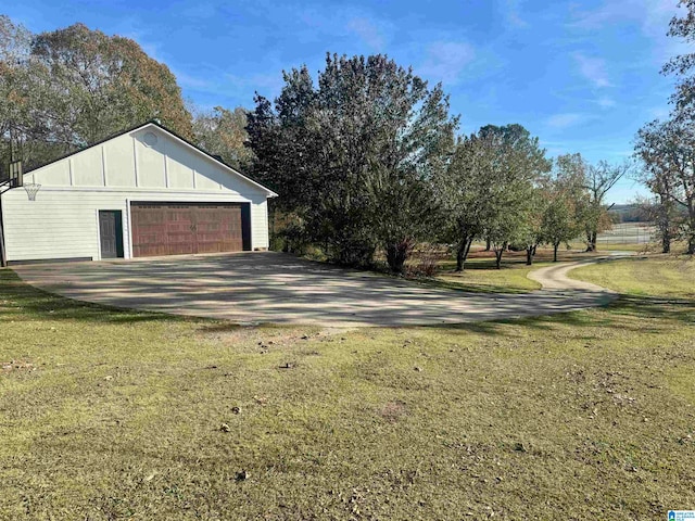 garage with a lawn