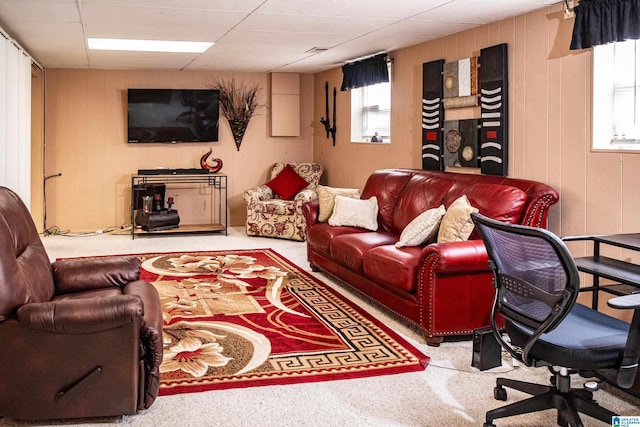 living room with a drop ceiling