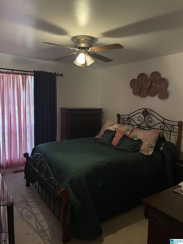 bedroom featuring ceiling fan and light colored carpet