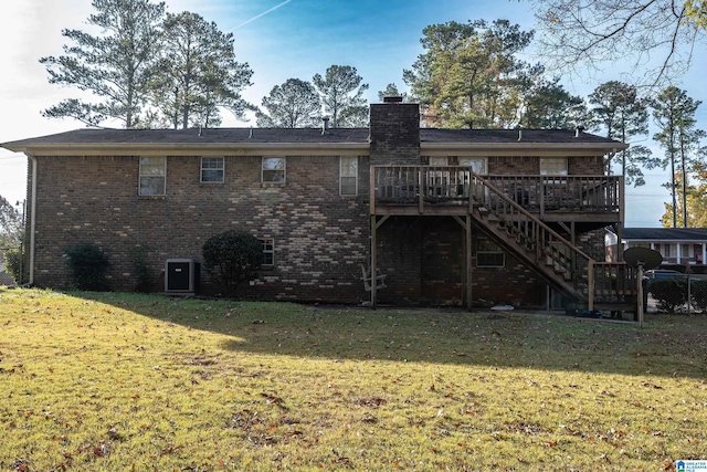 back of property featuring cooling unit, a yard, and a wooden deck