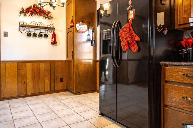 interior space featuring wooden walls and light tile patterned flooring