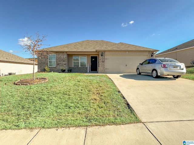 ranch-style home with a front yard and a garage