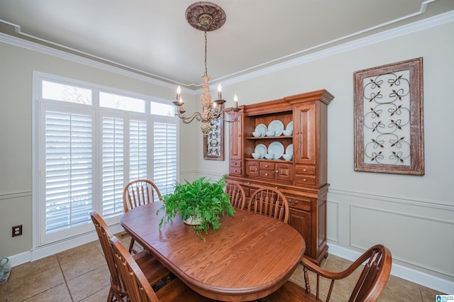 tiled dining room with crown molding and a notable chandelier