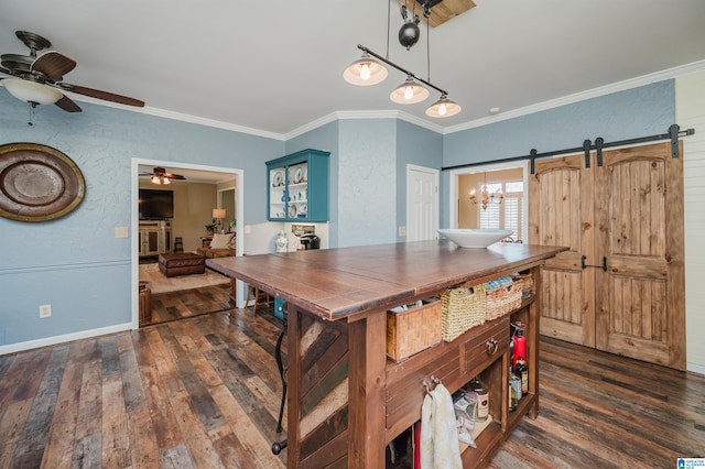 dining room featuring dark hardwood / wood-style floors, a barn door, ornamental molding, and ceiling fan with notable chandelier