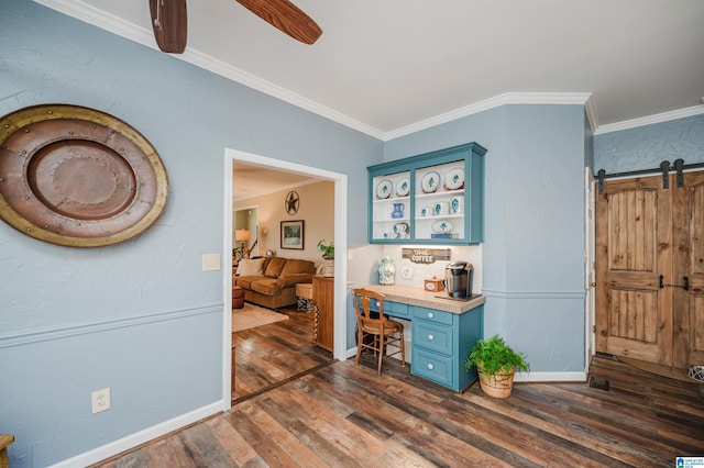 interior space featuring dark hardwood / wood-style floors, a barn door, and ornamental molding