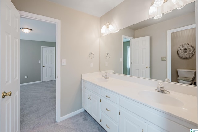 bathroom with vanity and toilet