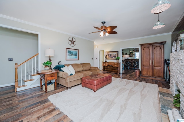 living room with ceiling fan, dark hardwood / wood-style flooring, and crown molding