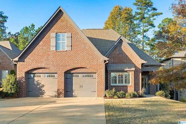 view of front facade featuring a garage and a front lawn