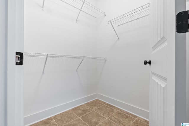 spacious closet with tile patterned flooring