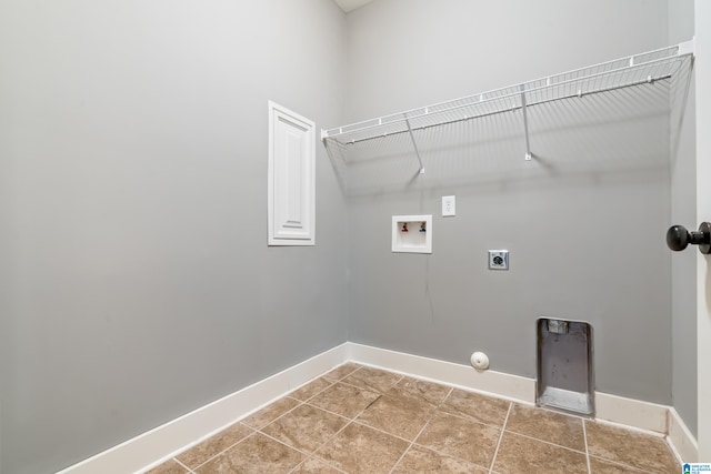 washroom featuring electric dryer hookup, tile patterned floors, washer hookup, and gas dryer hookup