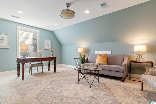 carpeted office with vaulted ceiling