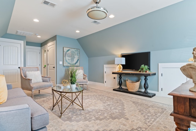 living room featuring lofted ceiling