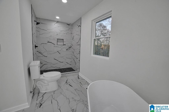 bathroom with tiled shower and toilet