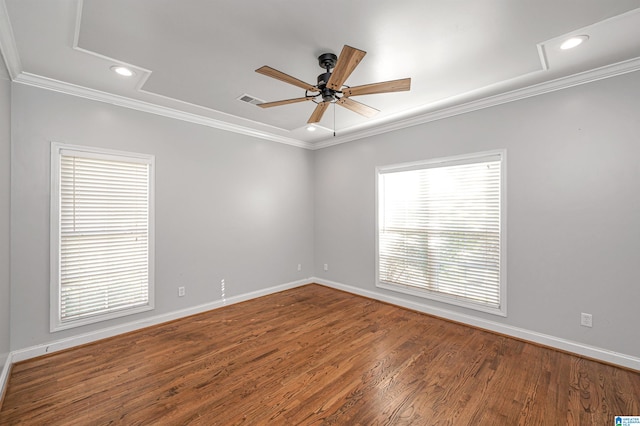 unfurnished room featuring hardwood / wood-style floors, ceiling fan, and crown molding