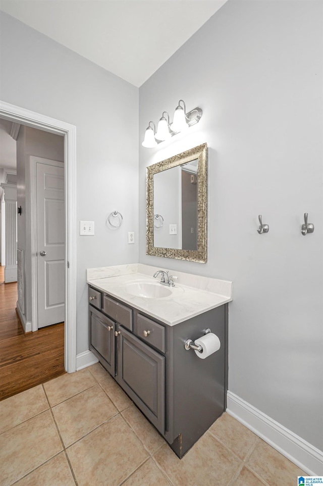 bathroom with vanity and wood-type flooring