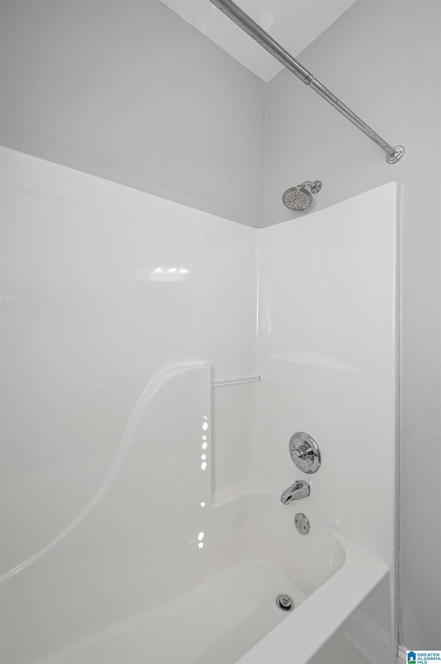 bathroom featuring  shower combination