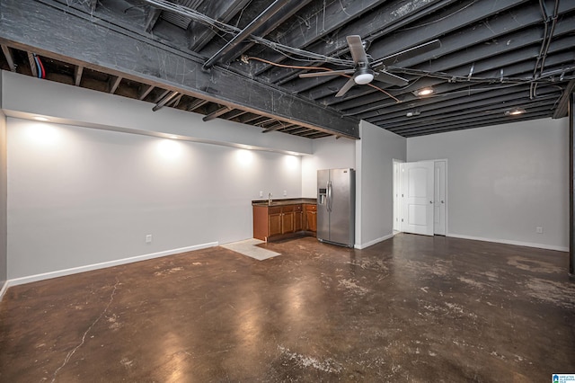 basement with stainless steel refrigerator with ice dispenser