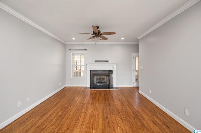 unfurnished living room featuring hardwood / wood-style floors, ceiling fan, and ornamental molding