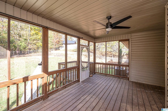 unfurnished sunroom with ceiling fan and wood ceiling