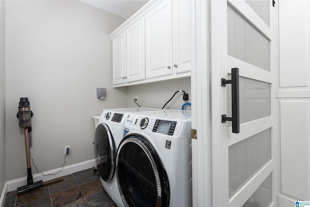 laundry room with cabinets and independent washer and dryer