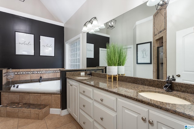 bathroom featuring vanity, an inviting chandelier, independent shower and bath, tile patterned flooring, and lofted ceiling