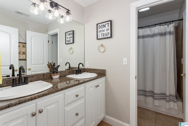 bathroom with tile patterned flooring, a shower with curtain, and vanity