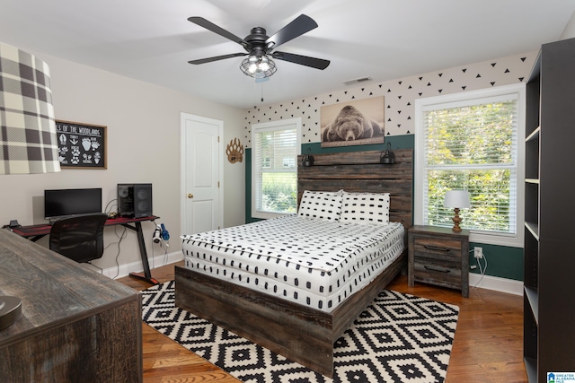 bedroom with hardwood / wood-style flooring and ceiling fan